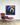 A striking piece of abstract bear canvas in black floating frame on wall.